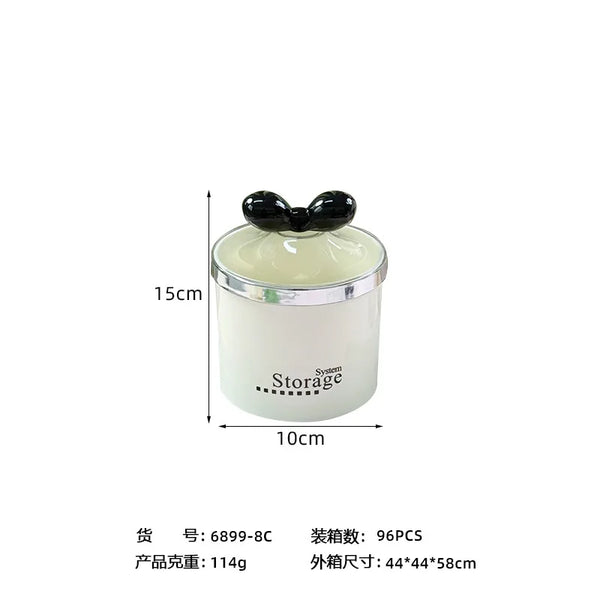 Plastic Round Storage Jar with Lid displayed with clear body and decorative black lid, ideal for organizing small items.