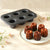 Carbon Steel 6-Cup Cannelé Baking Tray with freshly baked cannelés displayed on a plate, showcasing perfect caramelization.
