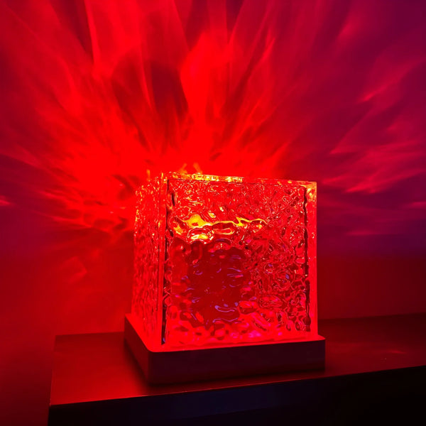 USB Ocean Wave Dynamic Water Ripple Pattern Lamp casting red flowing water-ripple light effects on walls.