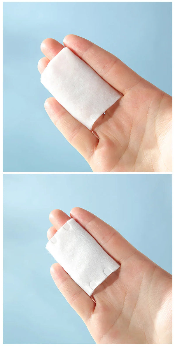 Hand holding 3 Layers Square Cotton Pads on a light blue background, showcasing the product's texture and size.