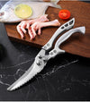 Chicken Shredder Tool: Stainless steel kitchen shears beside fish, lime, and tomato on a cutting board.