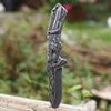 3D Embossed Dragon Folding Survival Knife with intricate detailing and a stainless steel edge, perfect for outdoor tasks.