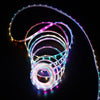 220V High Voltage Light Strip in multicolored coils on a dark background, showcasing flexibility and brightness.
