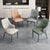 Nordic Leather Dining Chair with Metal Legs in various colors placed in a modern dining room setting.