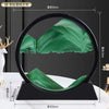 Round 3D Moving Sand Art Frame Hook featuring intricate green sand designs in a circular black frame.