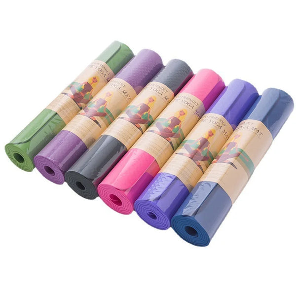 Thick Solid Yoga Mat for Fitness in various colors rolled up for easy storage.