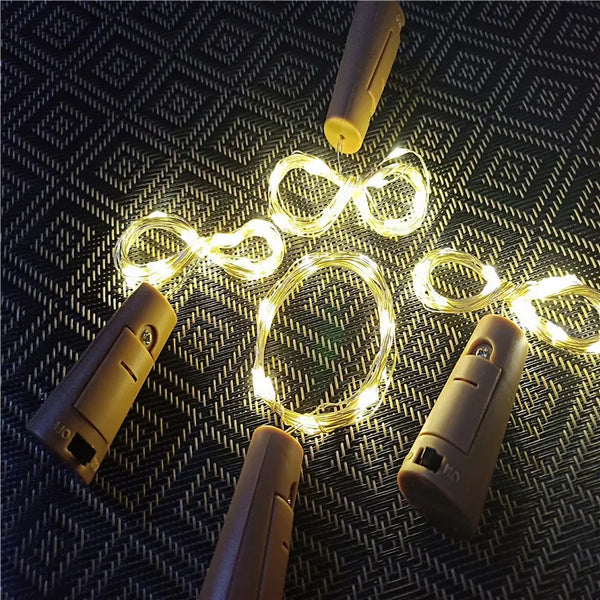 Cork Bottle Light LED Bar with glowing fairy lights and battery-powered corks for decorative party use.
