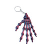 3D Printed Skull Hand Keychain Pendant in red and black, a detailed skeleton hand design for keys.