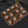Carbon Steel Shell Shape Baking Mold with twelve fluted baked madeleines in a tray.