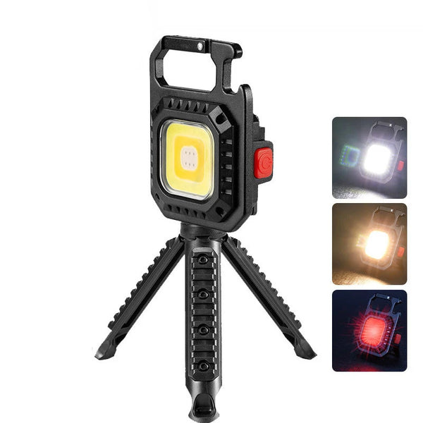 Portable COB LED Keychain Work Light with Tripod, compact and bright for repairs and camping.