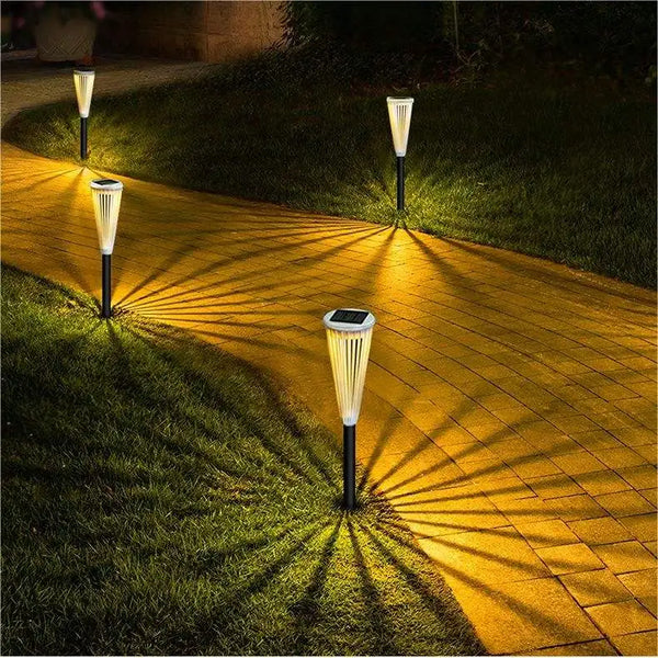 Waterproof LED Solar Street Light illuminating a garden pathway with beautiful shadows.