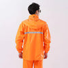Back view of a worker wearing a bright orange Safety Reflective Work Rain Coat with reflective strip.
