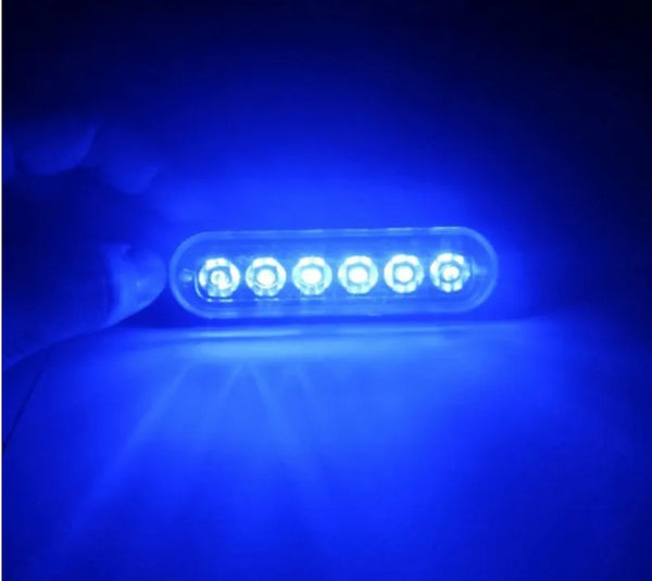 12V LED Traffic Warning Strobe Light Bar showing bright blue LEDs in a dim environment.