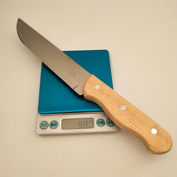 Stainless Steel Japanese Style Fruit Knife on a digital scale for accurate measurement.