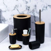 6-Piece Luxury Bathroom Accessories Set featuring bamboo accents and sleek black design on marble background.