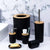 6-Piece Luxury Bathroom Accessories Set featuring bamboo accents and sleek black design on marble background.