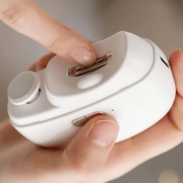Home Use Automatic Electric Nail Clipper showing a hand pressing the button on the device.