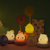 Mini USB Cooling Fan with Night Light featuring cute animal designs and soft illumination for a cozy workspace.