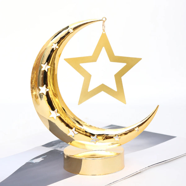 Gold Ramadan countdown calendar featuring a decorative gold crescent moon with stars and a hanging star.