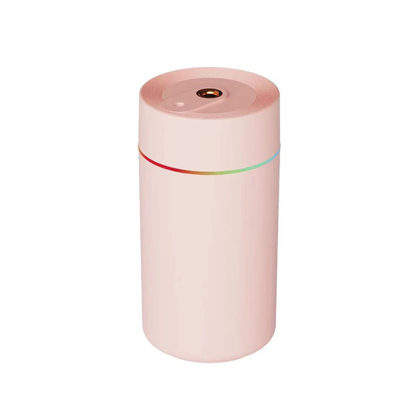 The Mini 420ml USB Air Humidifier in a pink color with a sleek design and top mist output.