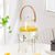 Glass Beverage Dispenser with Faucet showcasing lemon slices, stylish and functional for serving cold drinks.