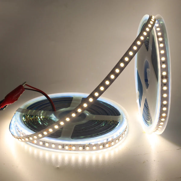 5m 12V 2835 SMD LED Strip Light rolled on a spool, showcasing its flexible design and bright illumination.