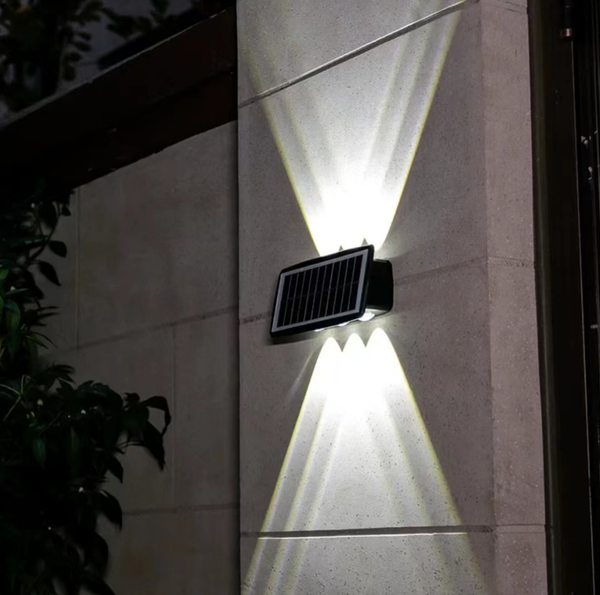 Solar LED RGB Wall Light illuminating a wall with vibrant beams, perfect for outdoor spaces.