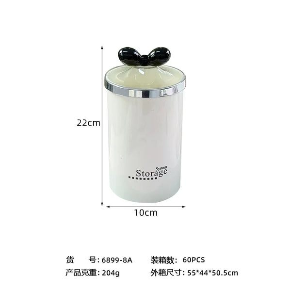 Plastic Round Storage Jar with Lid in white with a black lid, perfect for kitchen and bathroom organization.