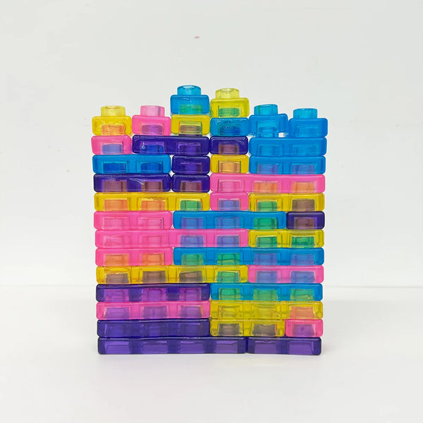 Colorful Soft Sensory Squishy Building Blocks stacked in vibrant hues of blue, pink, yellow, and purple.