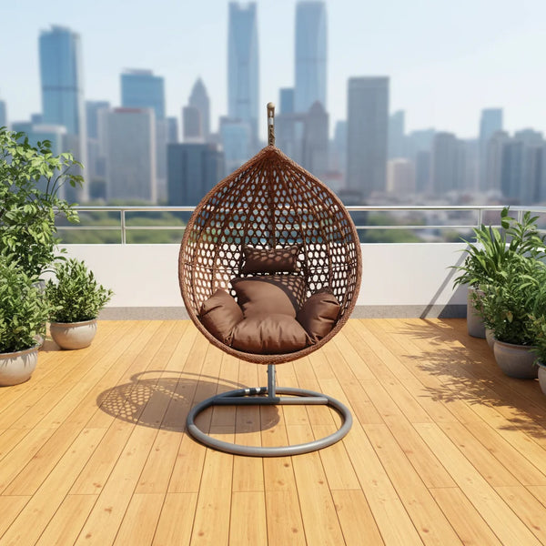 Modern Indoor-Outdoor Swing Chair featuring a stylish suspended design with cozy cushions, set against a city skyline.