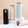 Four stylish colors of the 500ml Smart LED Vacuum Insulated Stainless Steel Flask on display.