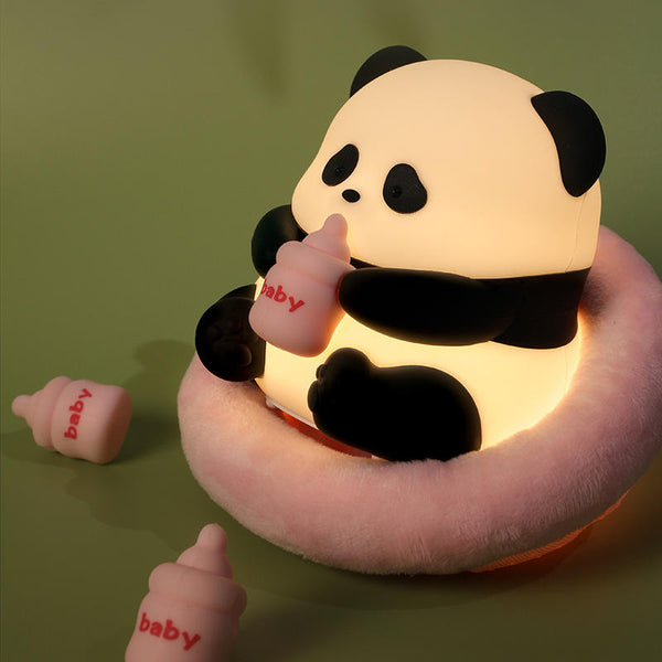 The Sitting Panda USB Night Light with a cute panda holding a bottle, surrounded by mini bottles.