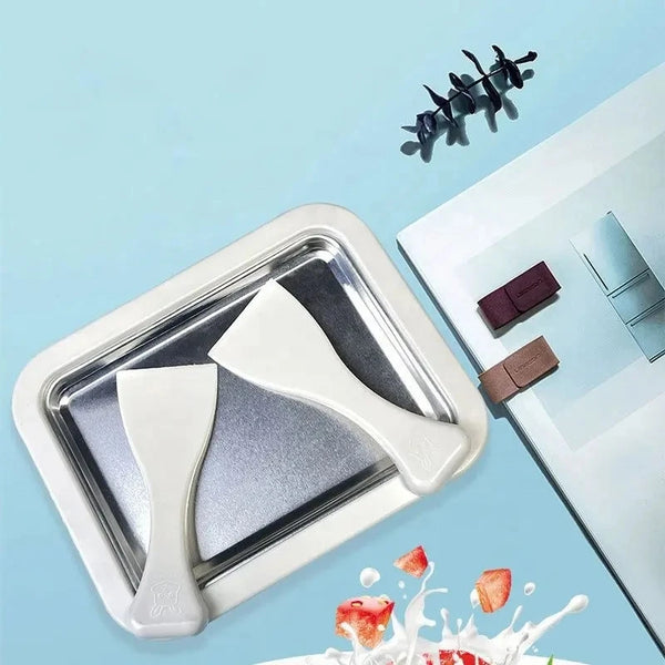 Mini Frozen Treat Maker accessories including a metal tray and two spatulas for creating frozen desserts at home.