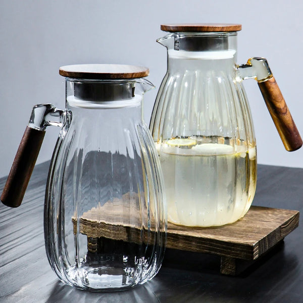High-Temperature Resistant Dining Table Placemat: Elegant glass pitchers with wooden handles, perfect for serving beverages with style.