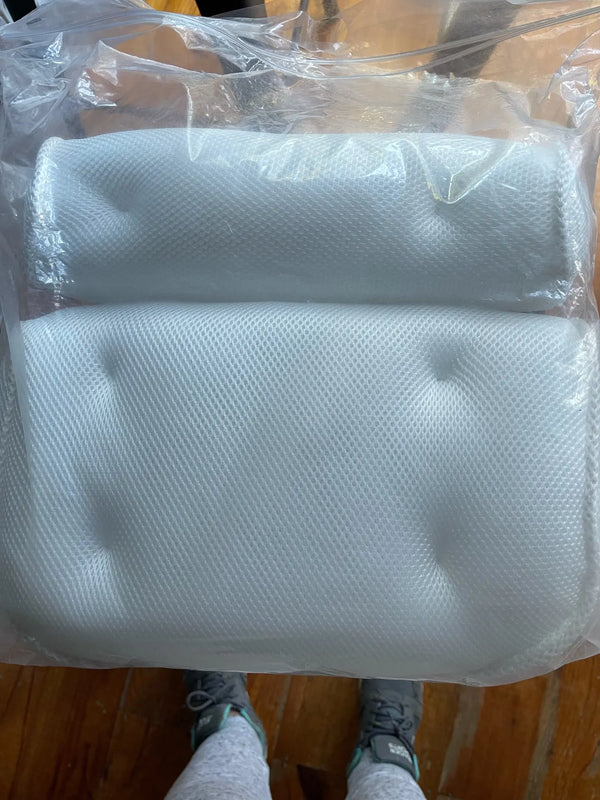 Non Slip Take Bath Pillow with Suction Cups in clear packaging, soft white design for comfort.