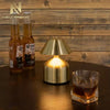 Retro Acrylic LED Desk Lamp Glow on a table next to drinks, creating a cozy atmosphere.