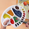 Hand holding a Paint Palette Resin Mold with colorful paint for DIY art projects.