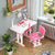 Metal Ergonomic Design Lift Chair and Table with Lamp in a bright room with a lamp and desk accessories.