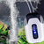 Portable Aquarium Oxygen Pump providing air flow in a well-maintained aquarium with bubbles and aquatic plants.