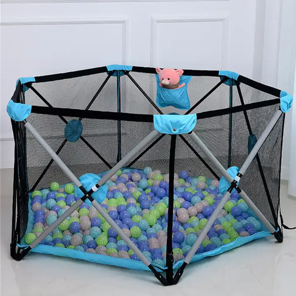 Hexagon Shape Infant Portable Playpen with colorful balls and a toy, perfect for safe playtime indoors or outdoors.