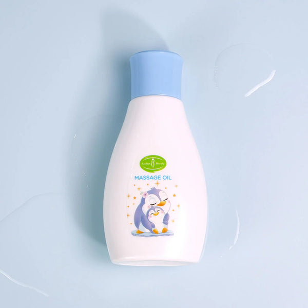 Vitamin E Soothing Baby Massage Oil in a bottle with a penguin design on a light blue background.