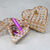Vintage Crystal Metal European Love Princess Jewelry Box with gemstones and pink pen on a smooth surface