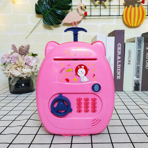 Suitcase Design Piggy Bank ATM Money Safe Box for Money in pink with cartoon design and keypad features.