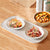 Portable Electric Food Warming Tray with two bowls of hot food on a wooden table.
