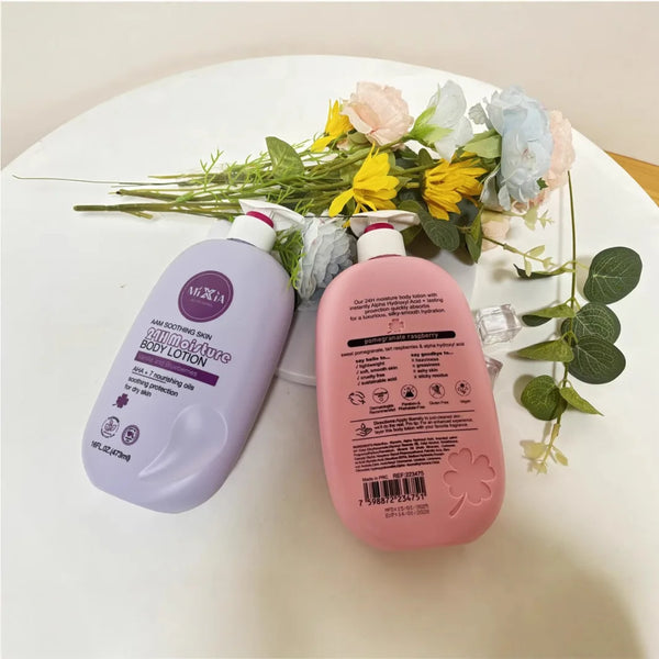 AHA Soothing 24H Moisture Body Lotion bottles placed on a table with flowers in the background.