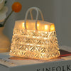 Crystal Bag USB Night Lamp providing soft ambient light on a bedside table, creating a cozy atmosphere.