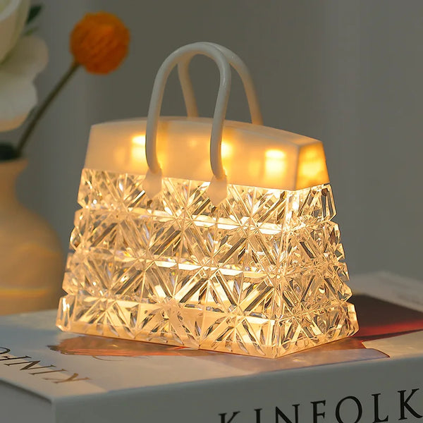 Crystal Bag USB Night Lamp providing soft ambient light on a bedside table, creating a cozy atmosphere.