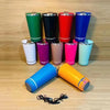 17oz Can Cooler Bluetooth Speaker Tumbler in various colors displayed on a wooden surface.