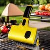 Heat-Resistant Electric Grill Brush Barbecue Cleaning Brush on grill with vegetables and cooked meat.