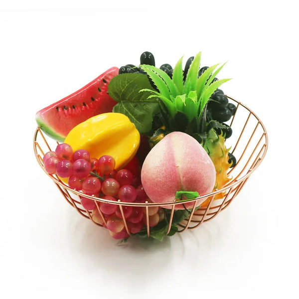 Colorful artificial fruits in a stylish Metal Storage Rack on a white background.